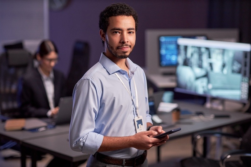 waist-up-portrait-of-man-looking-at-camera-standin-2023-11-27-05-00-09-utc