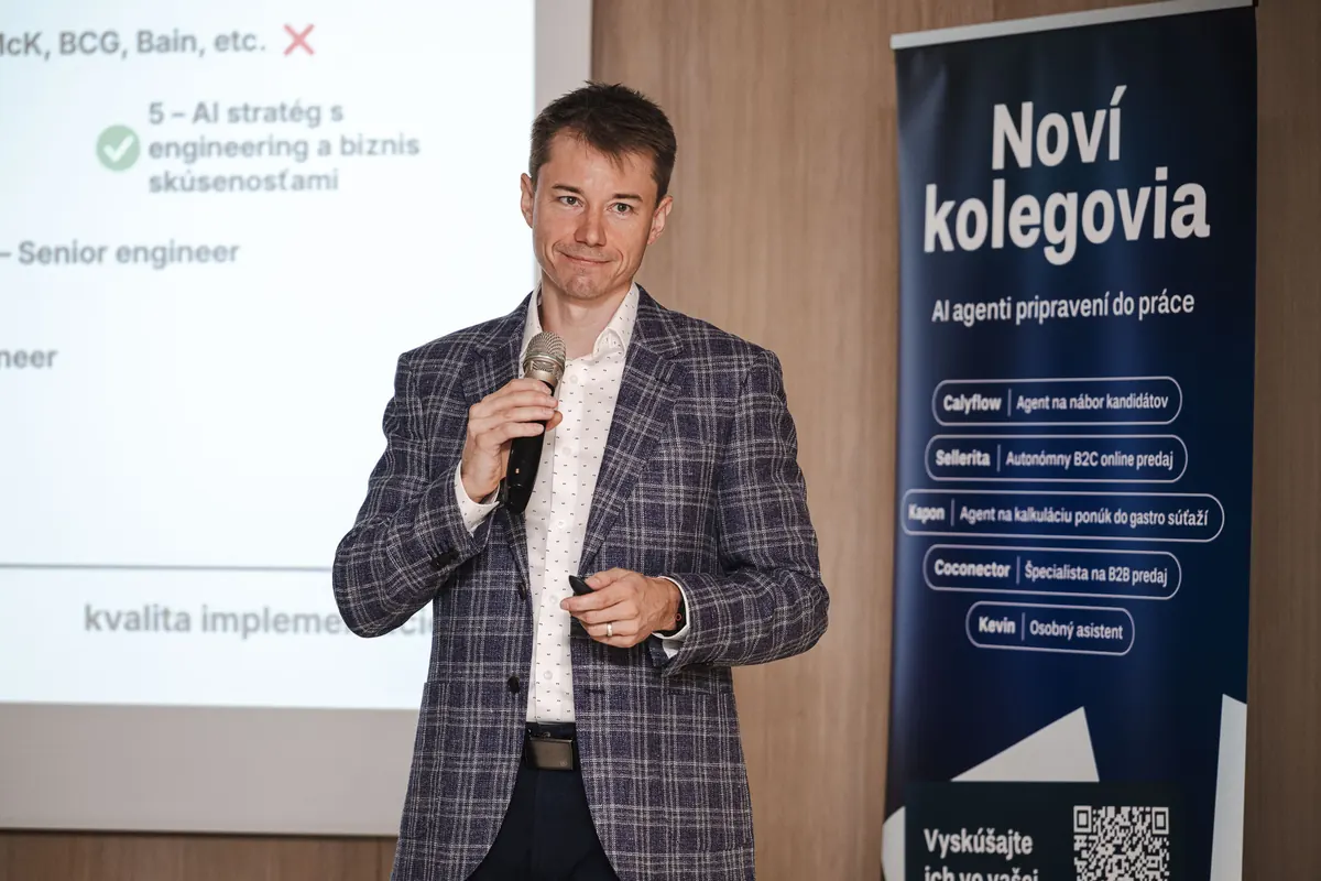 Michal Juhas speaking with a microphone