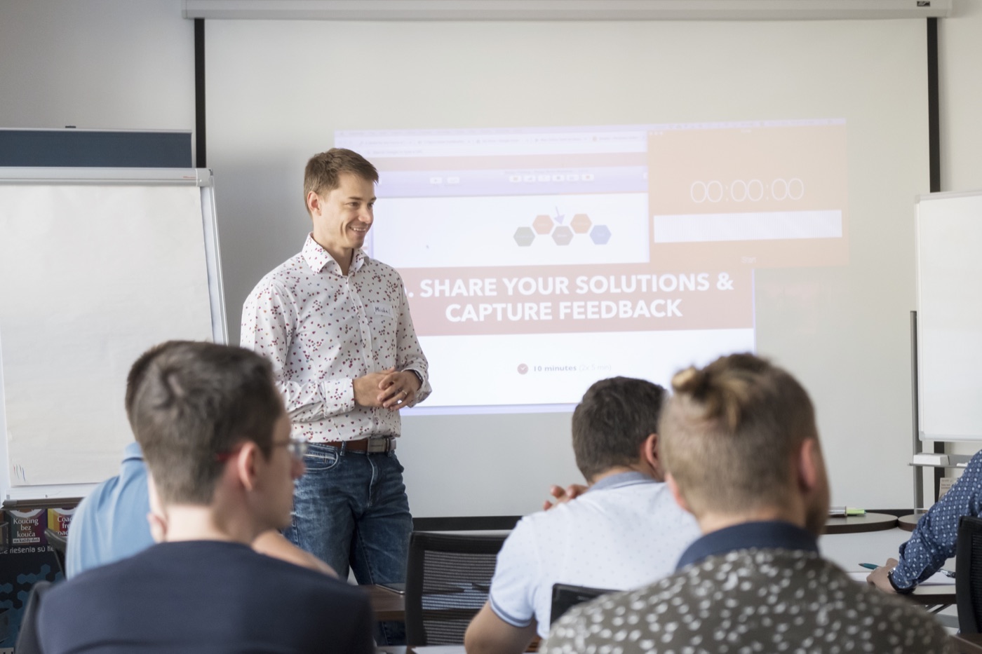 Michal Juhas leading a session on sharing solutions and capturing feedback (2018)