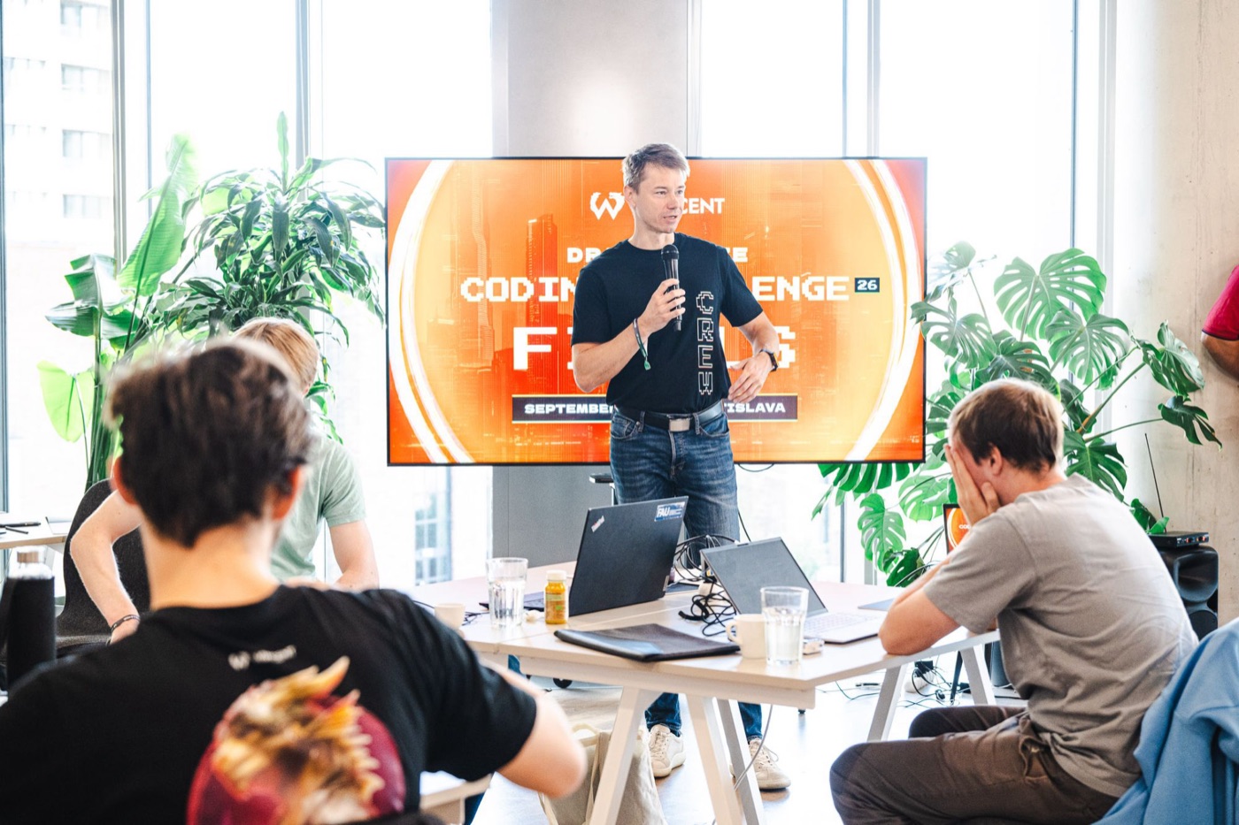 Michal Juhas speaking at the Wincent Dragobyte Coding Challenge 2026 finals in Bratislava